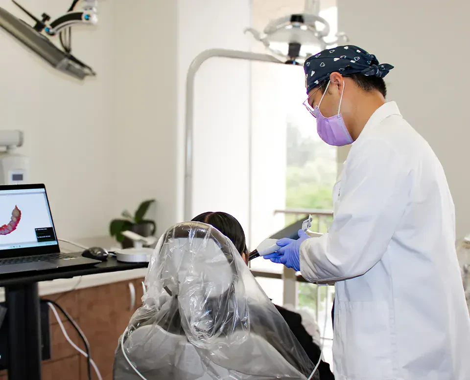 Dr. Zhang caring for a patient at Fullerton Smile Dentistry